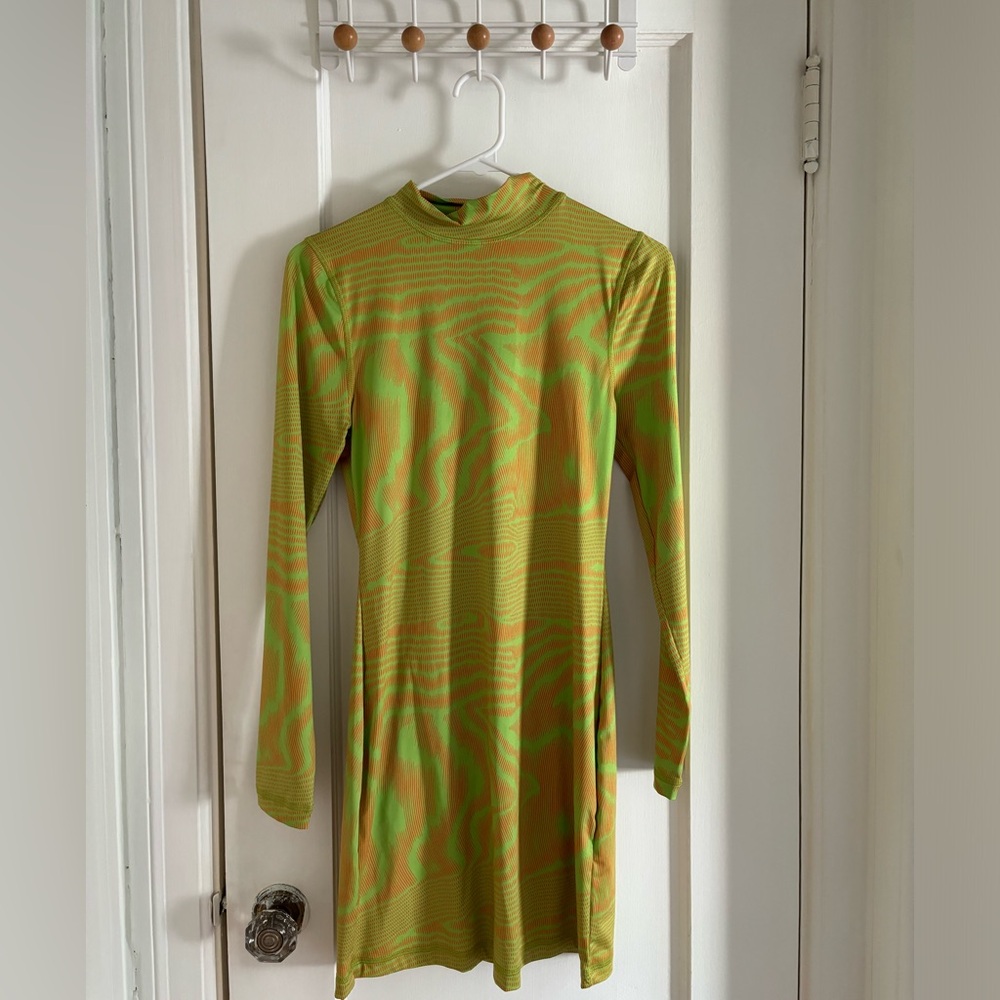 a line mini dress with lime green and orange acid style print